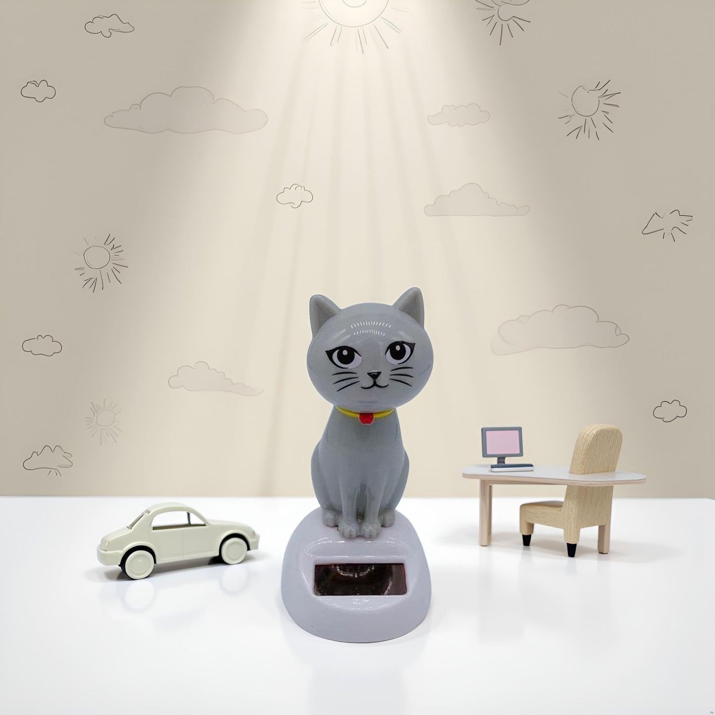 Whimsical solar wobble figure kitten designed for vehicle interiors and office spaces
