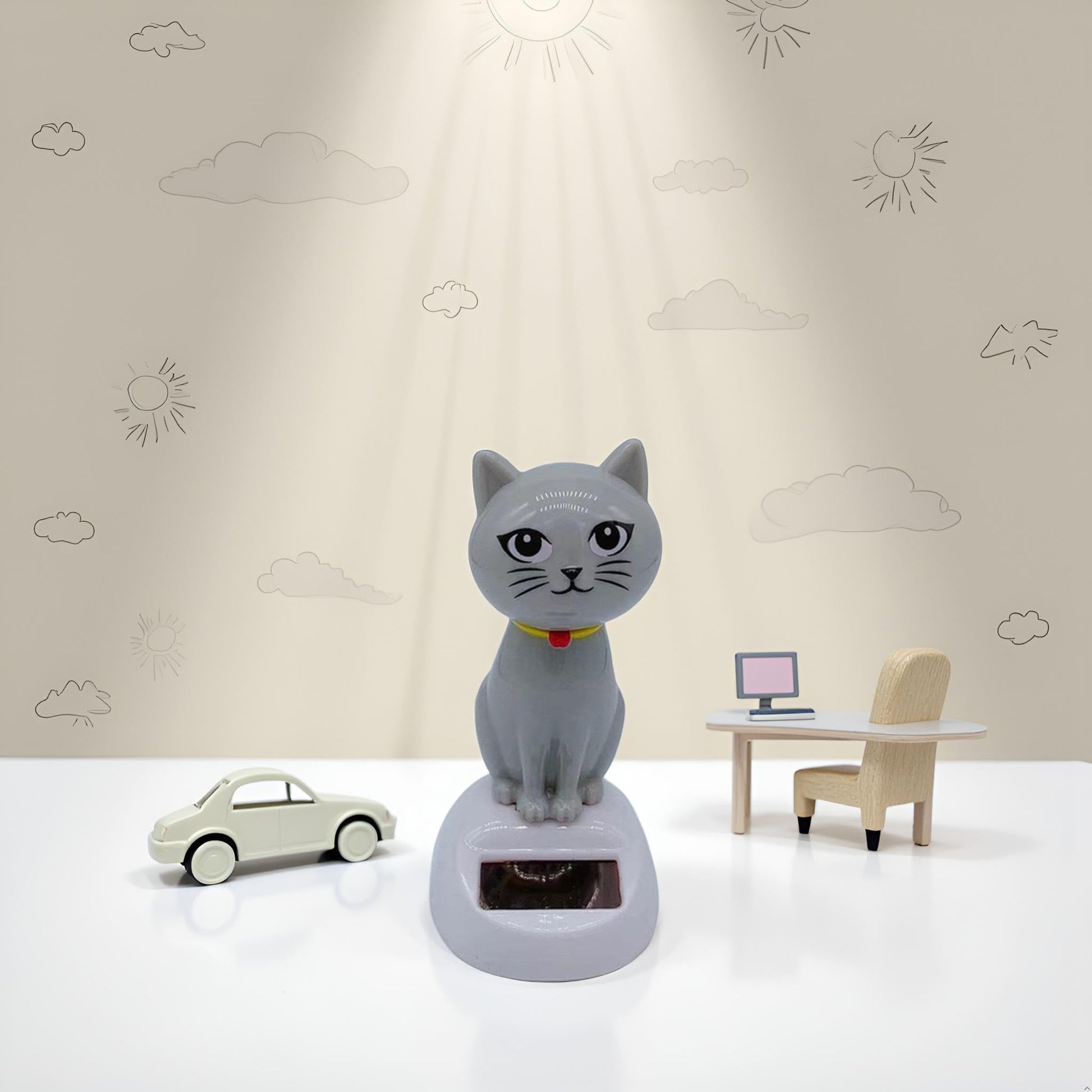 Whimsical solar wobble figure kitten designed for vehicle interiors and office spaces