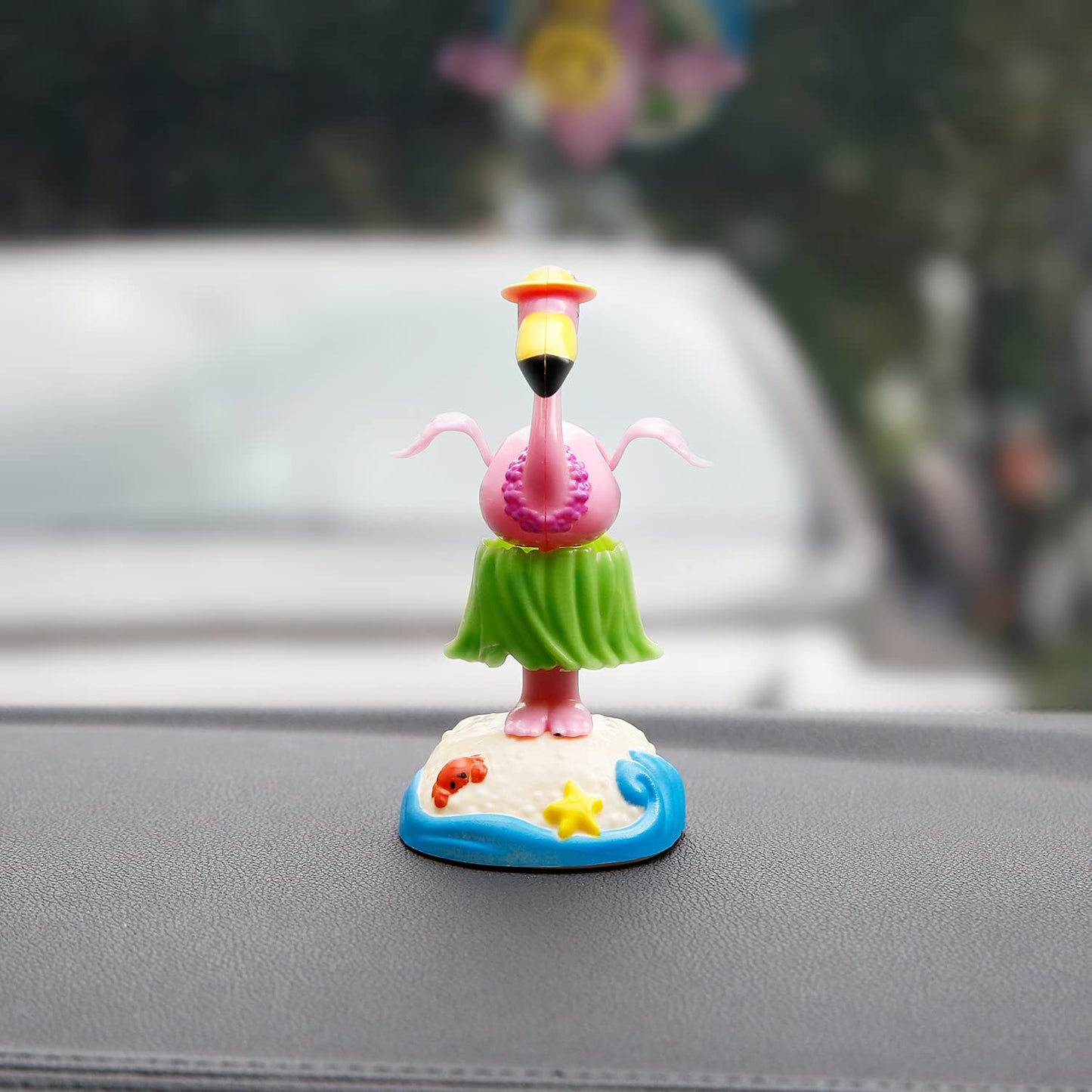 YGMONER swinging dress flamingo car ornament displaying the detailed yellow sun hat and small starfish accessory