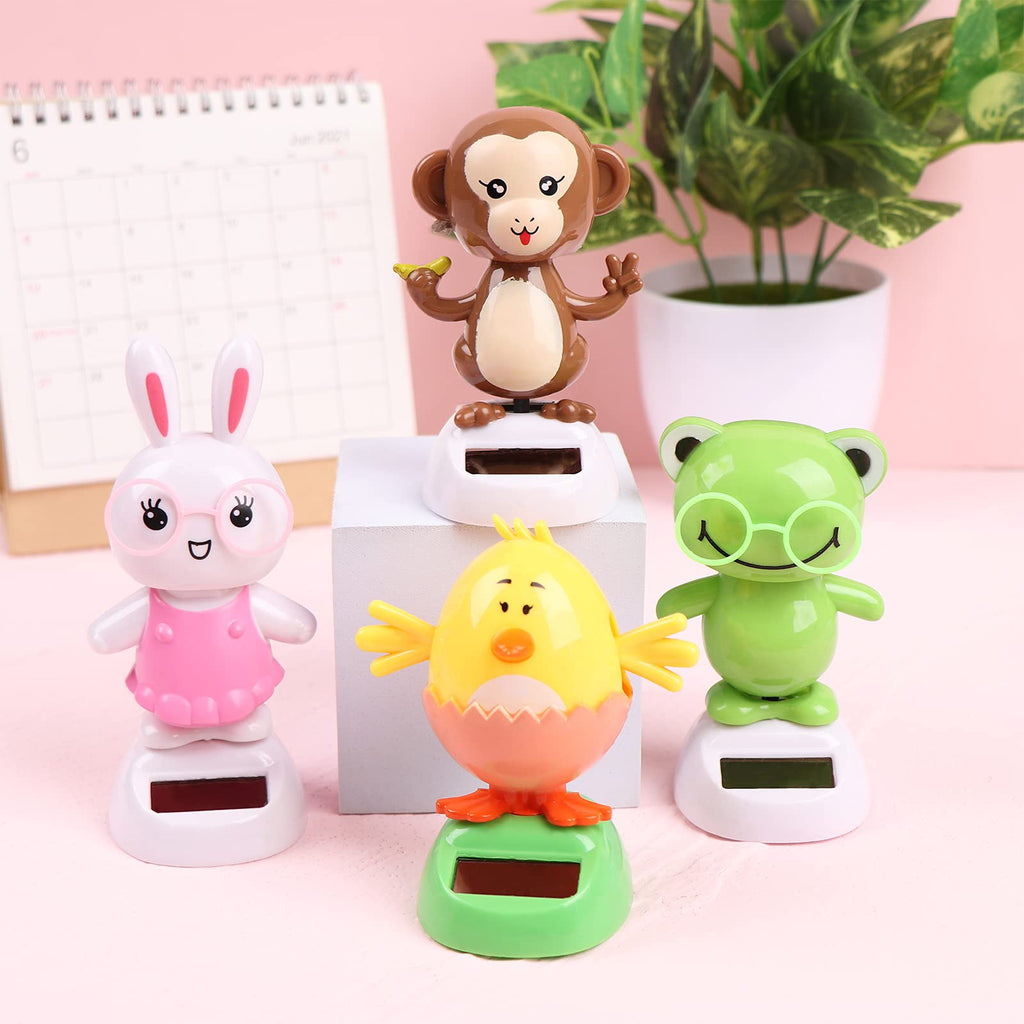 Welecom swinging rabbit dashboard figurine moving under bright office desk lighting.