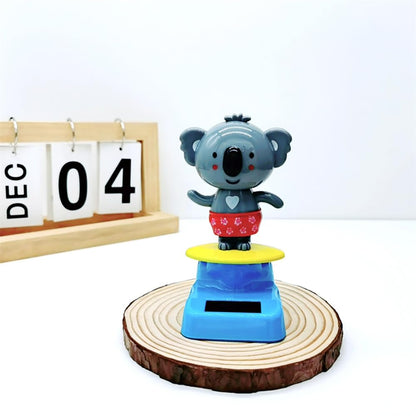 Compact eleven centimeter solar animal toy placed on a sunny windowsill
