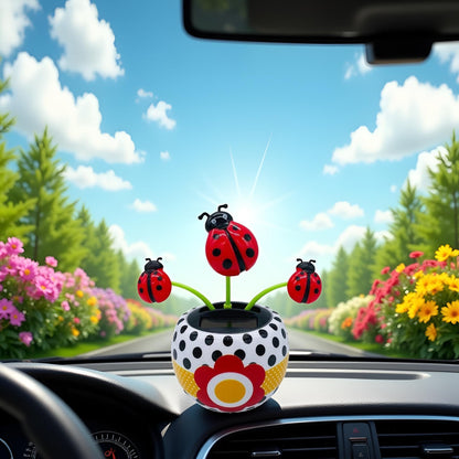 Eco friendly red bug bobblehead accessory inside a modern vehicle interior.