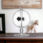 Aesthetic lifestyle placement of the DORAMI clear solar radiometer on a wooden study table.