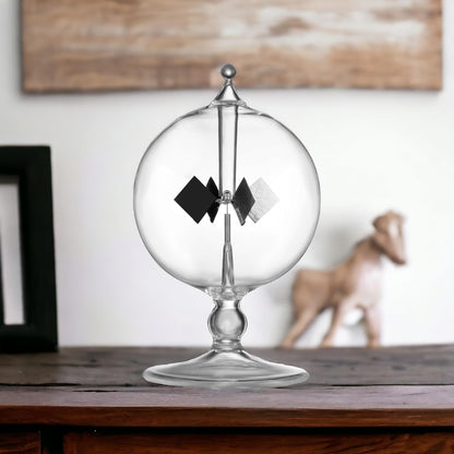 Aesthetic lifestyle placement of the DORAMI clear solar radiometer on a wooden study table.