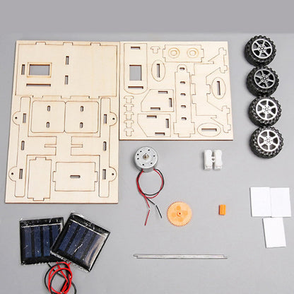 Side angle view of the solar-powered exploration vehicle kit highlighting the mechanical gears and wheels.