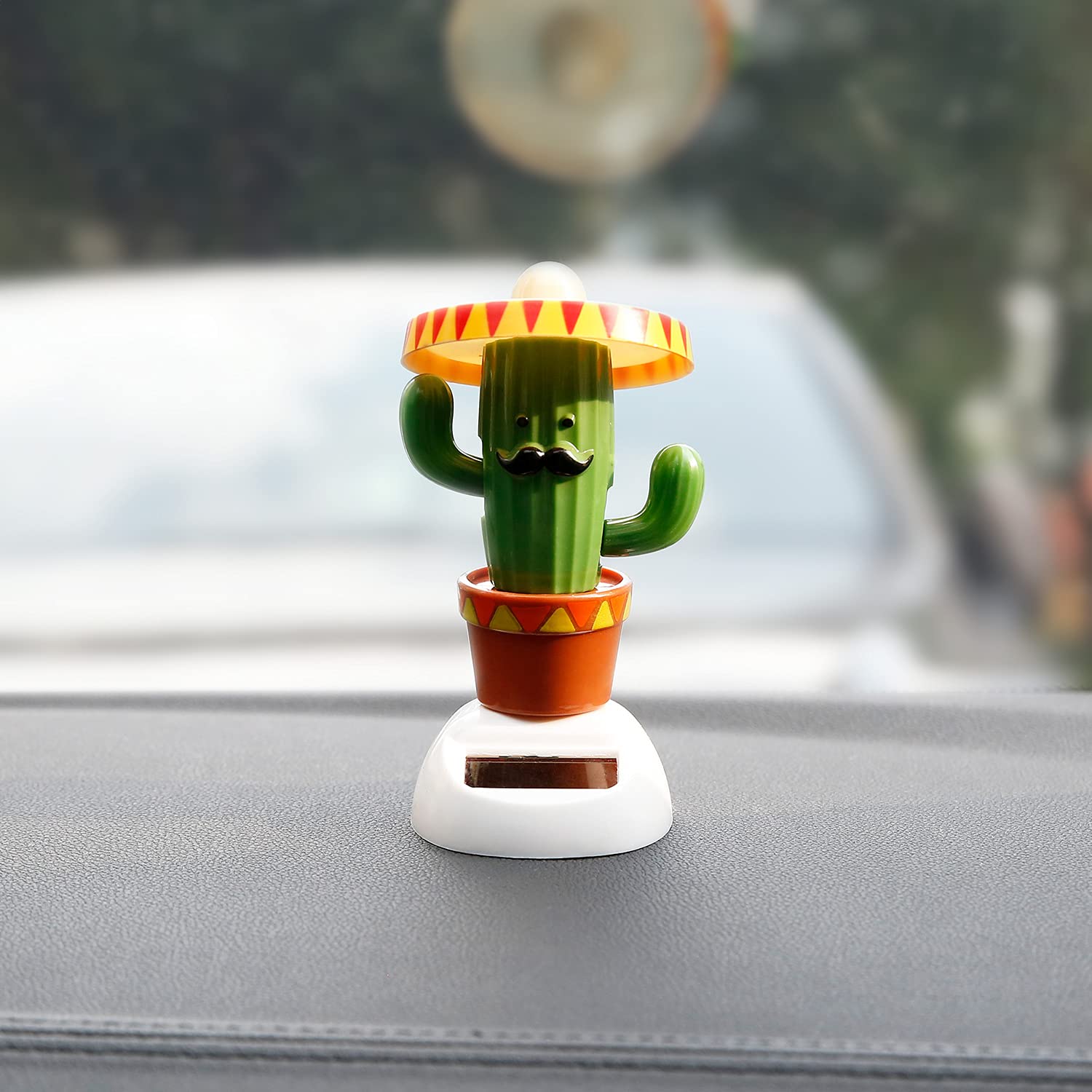 Side view of the solar shaking head green cactus showing the base panel