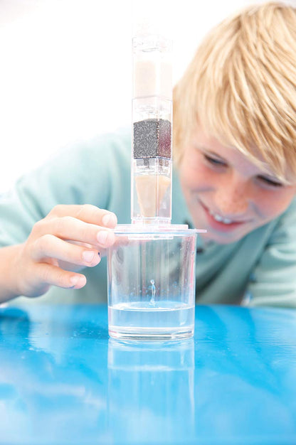 Clear water dripping through the filter paper section of the educational science toy.