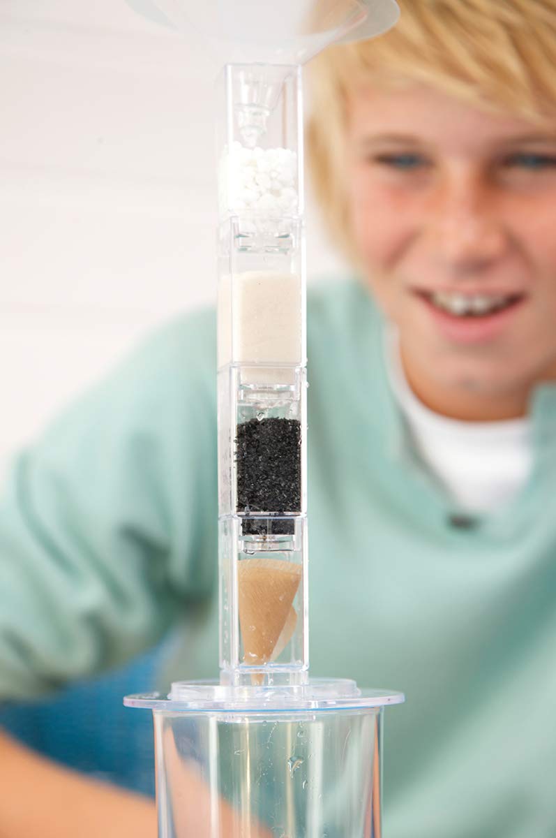 Instruction manual opened to the solar pasteurization and climate change experiment page.