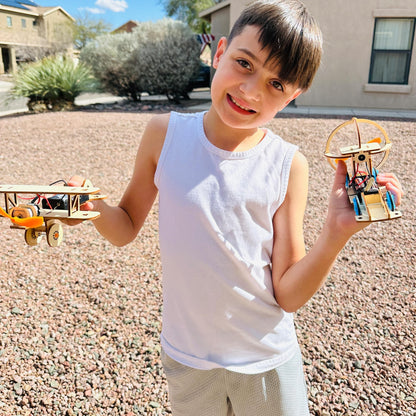 Assembled wooden solar powered car model from the CYOEST science kit operating under direct sunlight.