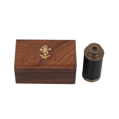 Handcrafted Trading Co. antique brass handheld telescope collapsed inside its protective wooden display case.