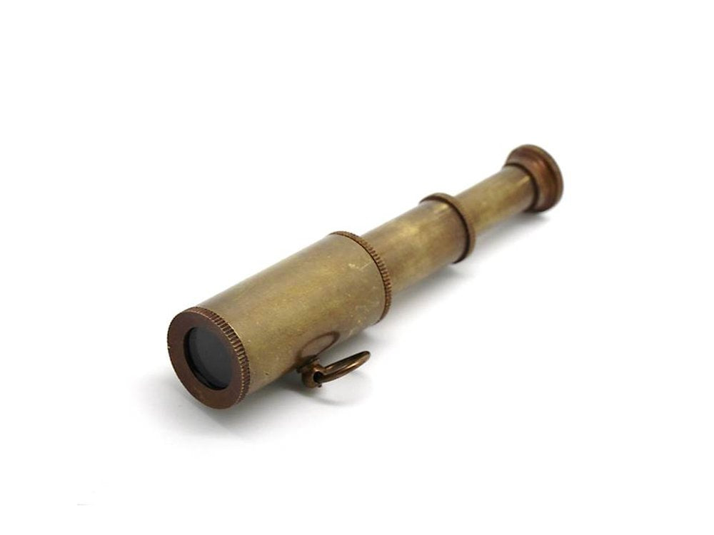 Five piece antique style brass maritime miniatures including telescope and pocket compass on table