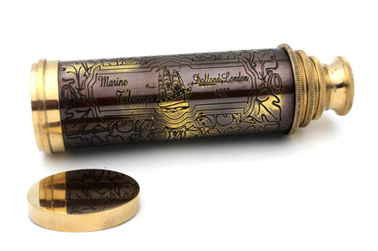 Antique brass telescope resting next to its custom crafted wooden box