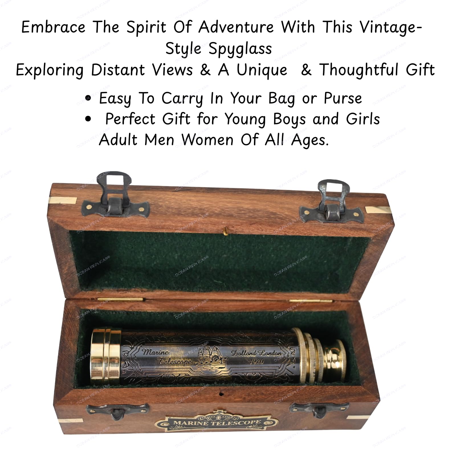 Ocean Replicas fourteen inch engraved brass spyglass telescope resting next to its open wooden storage box