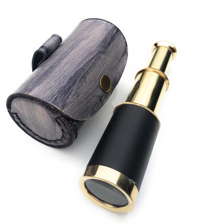 NauticalMart six inch vintage spyglass telescope collapsed next to brown leather storage bag