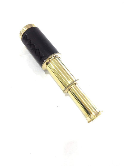 NauticalMart handheld brass telescope showing detailed stitching on the black leather protective sleeve