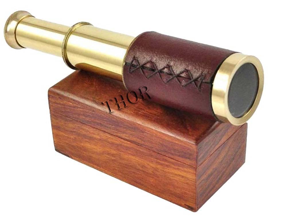 Close up view of the intricate leather wrapping and polished brass details on the Thor Instruments handheld telescope