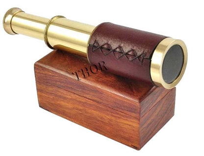 Close up view of the intricate leather wrapping and polished brass details on the Thor Instruments handheld telescope