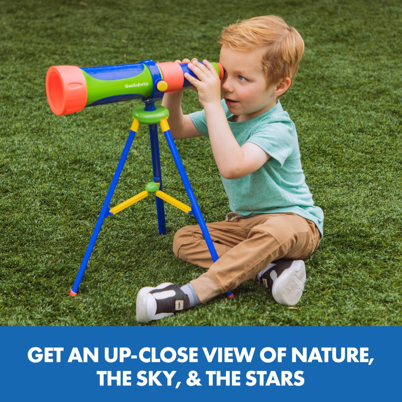 Close up view of the chunky focus knob and colorful mint green body of the preschool astronomy toy.