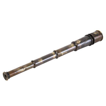 Handheld vintage monocular telescope showing the engraved Dollond London branding
