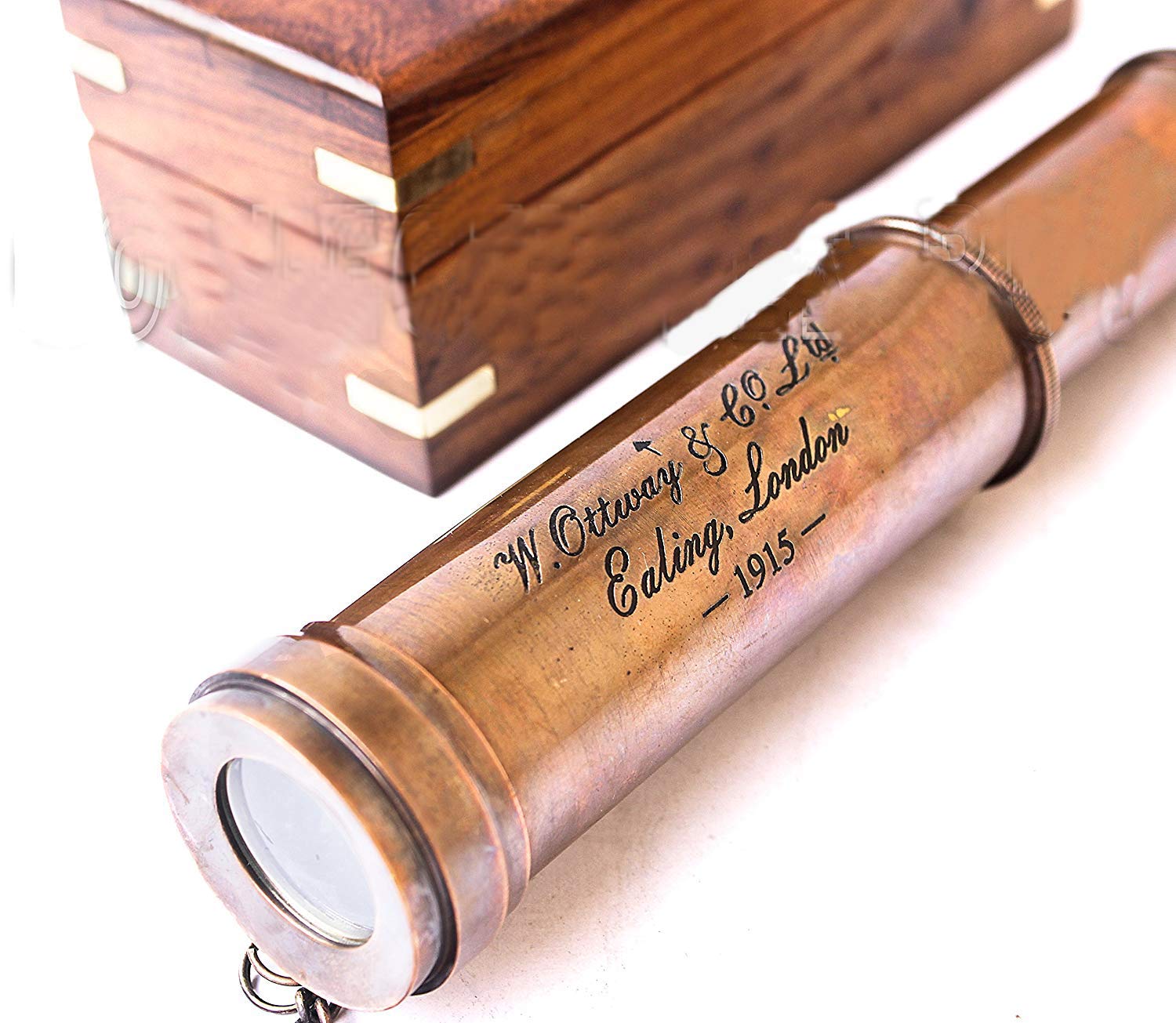 Handcrafted wooden storage box with a brass anchor inlay open with the telescope inside.