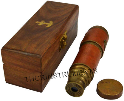 Handmade rosewood storage box open showing collapsed vintage brass telescope inside