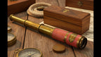 THOR INSTRUMENTS collectible brass telescope safely placed next to its wood box
