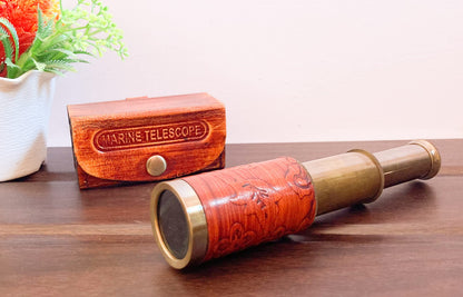 Khybex International pocket telescope collapsed neatly next to its matching brown embossed leather case.
