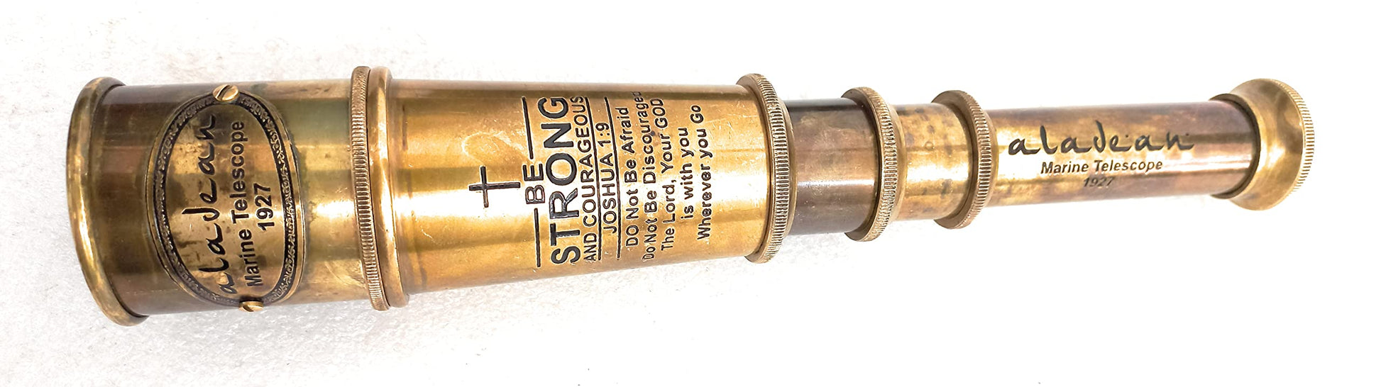 Close up view of the engraved inspirational quote on the Aladean nautical spyglass barrel.