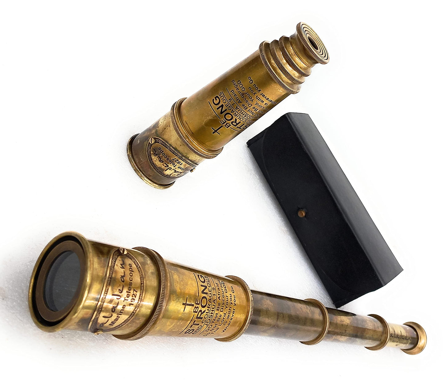 Aladean Victorian style handheld monocular telescope showing the optical glass eyepiece lens.