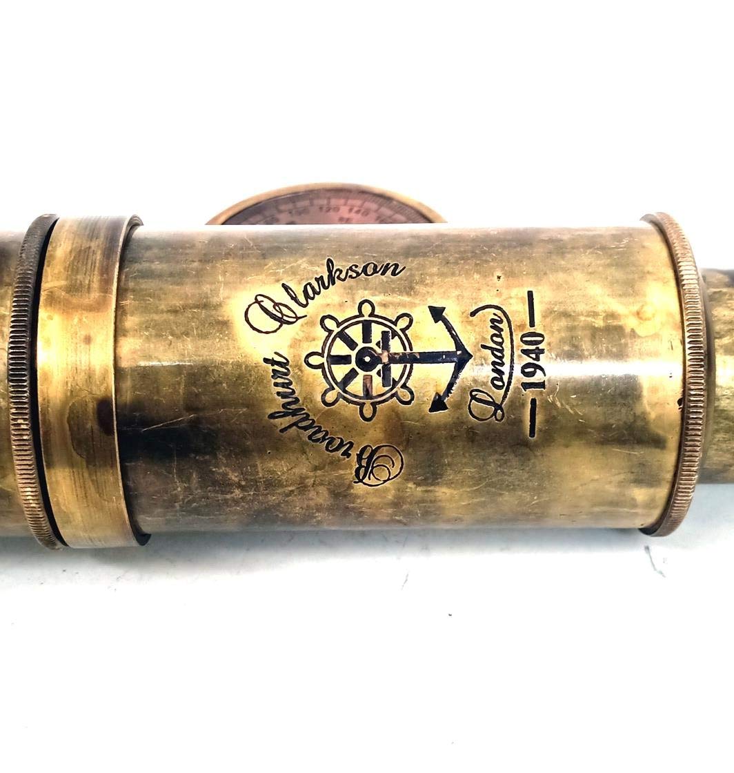 Vintage maritime collectible telescope resting on a rustic wooden surface