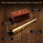 Vintage brass pirate telescope collapsed next to its closed wooden storage case.