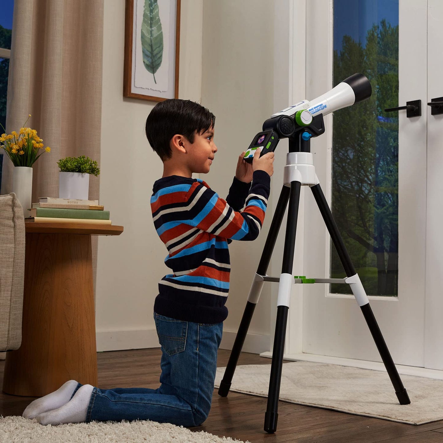 LeapFrog educational telescope displaying NASA space videos on screen