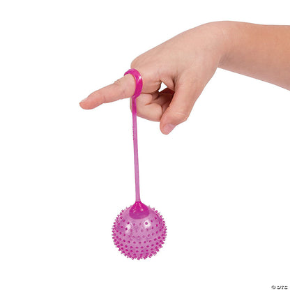 Child playing with Fun Express neon yoyo ball toy