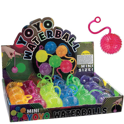 Close up of squishy neon water ball with elastic string