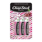 ChapStick Classic Cherry lip balm packaging with three sticks on a polka dot background.
