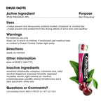 Drug facts label for a lip balm tube on a white background, with text detailing active ingredient White Petrolatum 45%, purpose as skin protectant, uses, warnings, directions, and inactive ingredients. The lip balm tube is shown with cherries and green leaves as graphic accents on the right side.