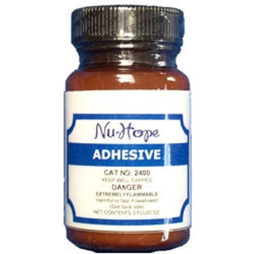 NuHope Liquid Waterproof Adhesive 3 ounce bottle front view medical ostomy cement