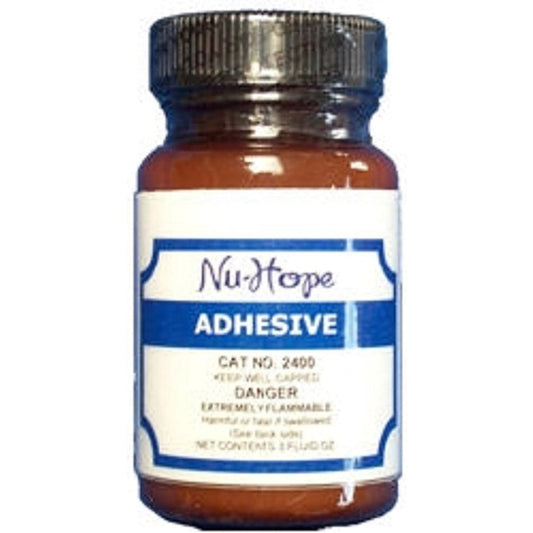NuHope Liquid Waterproof Adhesive 3 ounce bottle front view medical ostomy cement