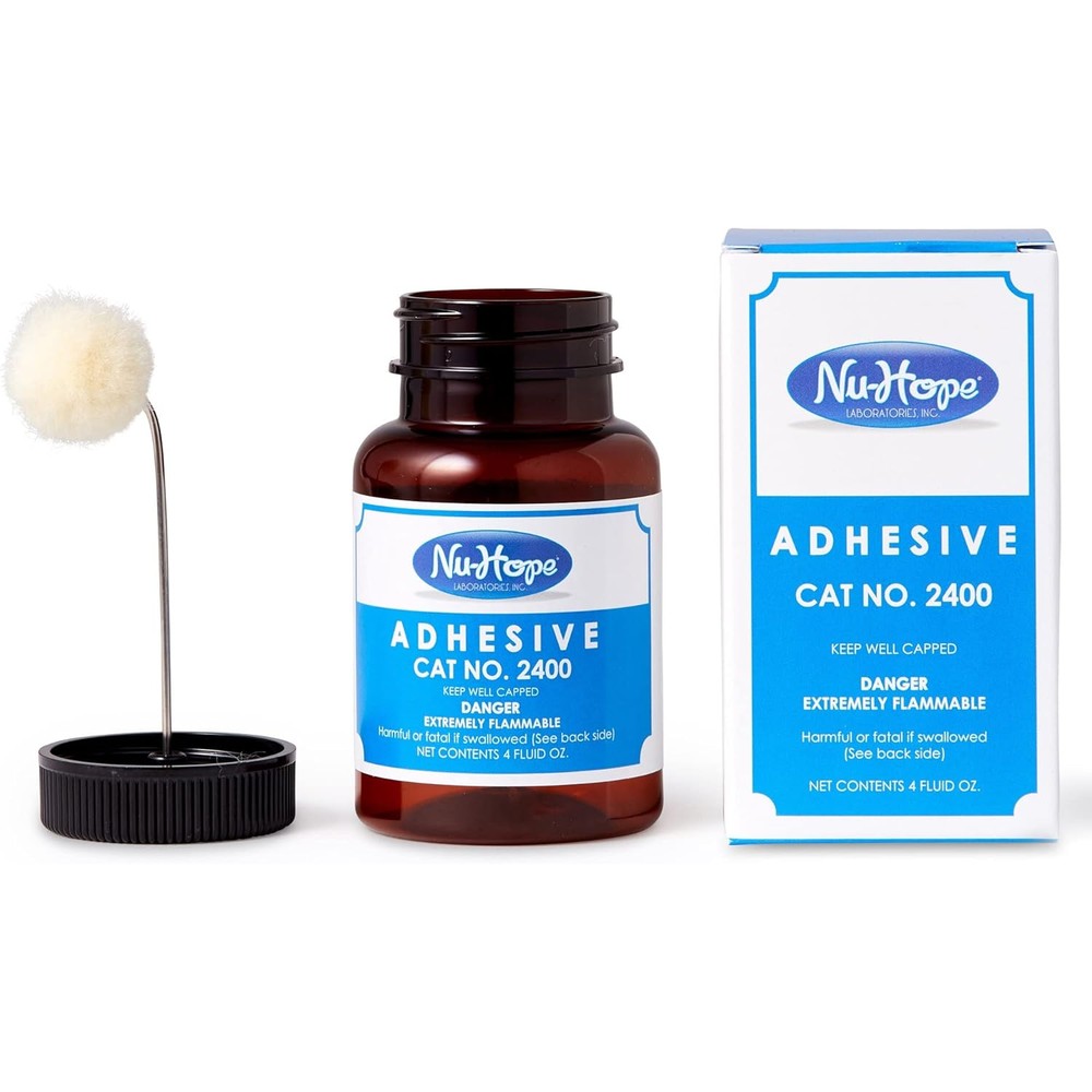 Nu-Hope Laboratories Ostomy Adhesive Cement 2400 bottle with applicator for waterproof medical bonding.
