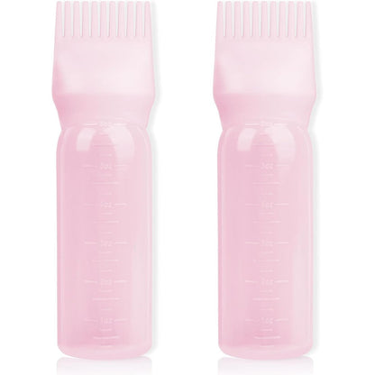 BLAAROOM root comb applicator bottle front view showing pink plastic squeeze body and comb cap design.