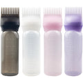 ZGQHZR Root Comb Applicator Bottle front view showing the four colorful six ounce bottles with comb attachments.