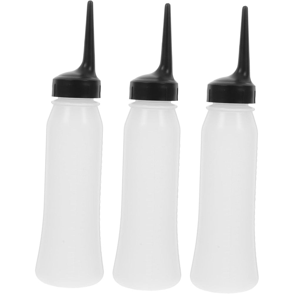 Comair Germany hair dye bottles front view showing clear plastic body and graduated scale markings.