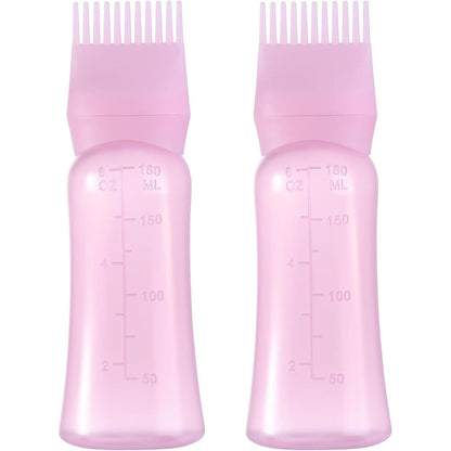 Dymoece root comb applicator bottle pink front view showing graduated scale markings.