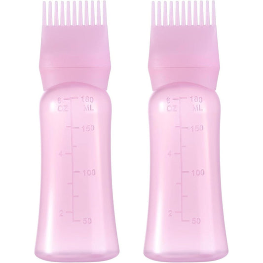 Dymoece root comb applicator bottle pink front view showing graduated scale markings.