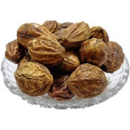 Onmexa Badi Harad Yellow Haritaki whole dried fruit front view