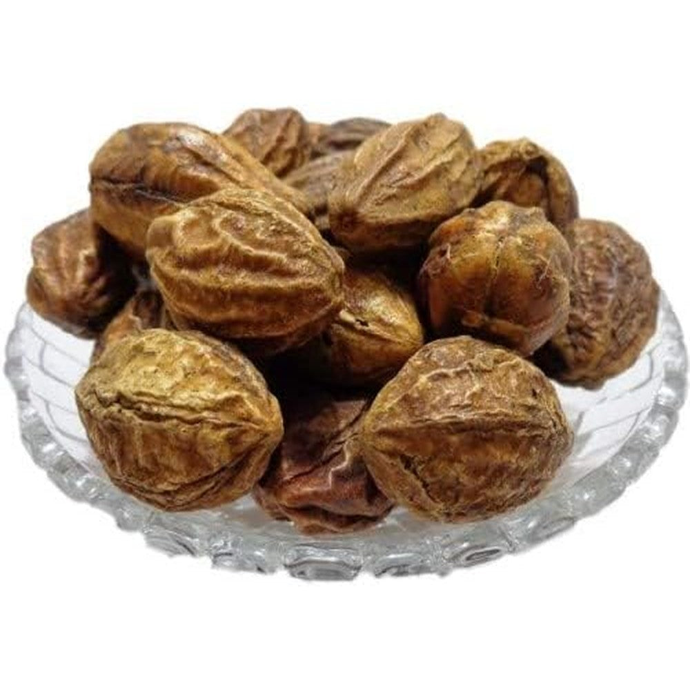 Onmexa Badi Harad Yellow Haritaki whole dried fruit front view