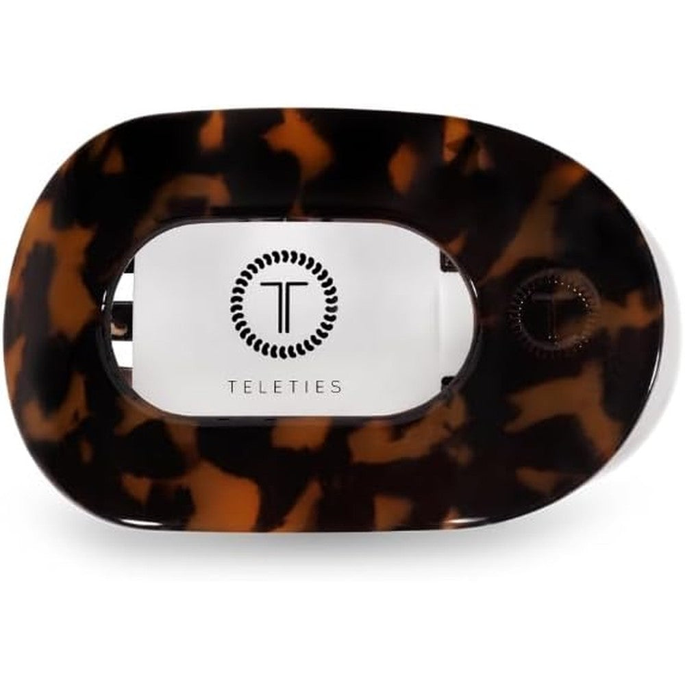 Teleties small flat round clip in tortoise front view showcasing its ergonomic curved profile for comfortable lounging.