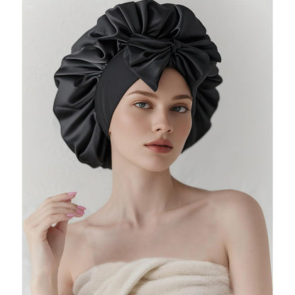 COCOSILK satin hair bonnet front view showing black adjustable wide tie band for curly hair protection.