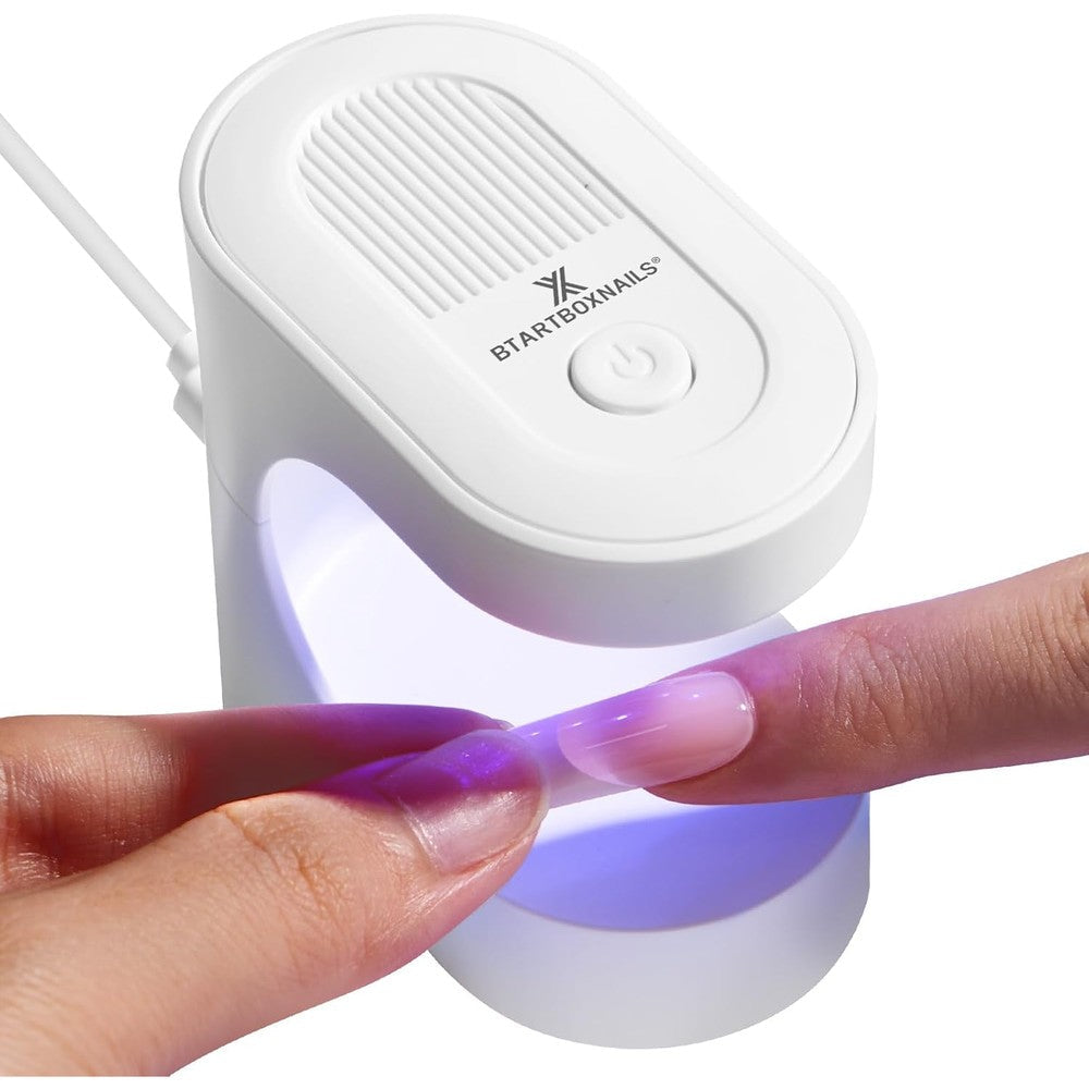 BTArtboxnails Handy Mini Nail Lamp front view showing white compact handheld design for curing gel extensions.