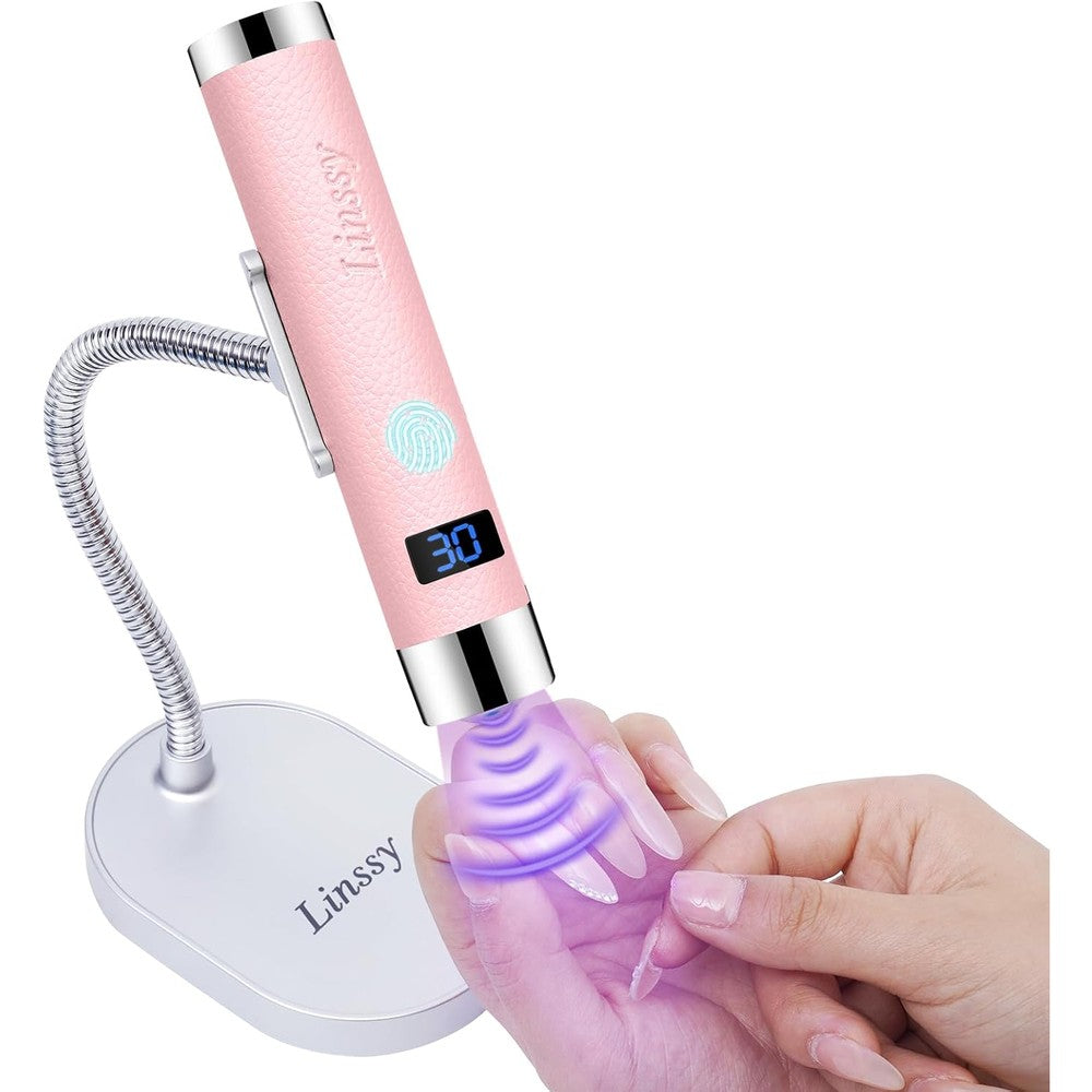 Linssy mini UV light for nails front view showing pink faux leather exterior and digital LCD timer screen